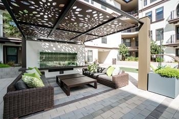 Central courtyard with bbqs, fireplace, outdoor kitchen and green space for recreation